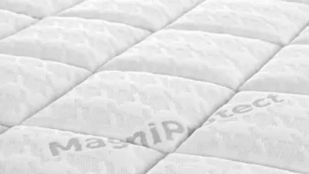 a close up of a bed MagniProtect